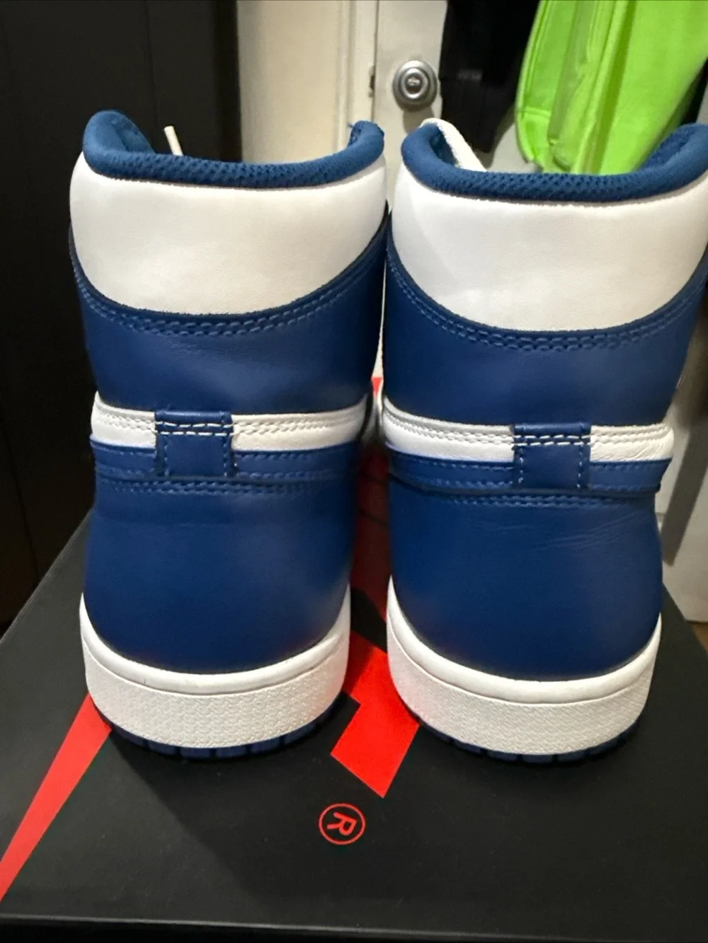 Jordan Air Jordan 1 Mid White and Blue Sneakers